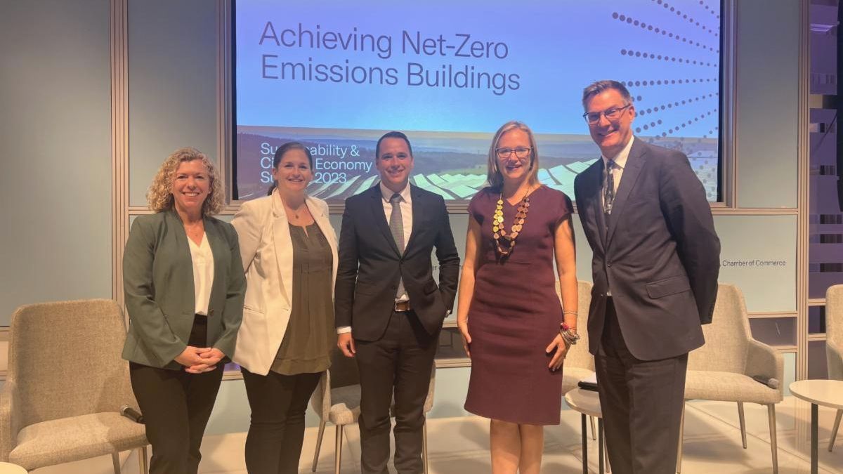 Photograph of BCSE President Lisa Jacobson; Lindsey Falasca, Director of Net-Zero Federal Buildings for the White House Council on Environmental Quality; Mike Kazmierczak, Vice President of Decarbonization for Schneider Electric; Mandy Mahoney, Director of the U.S. Department of Energy’s Building Technologies Office; and DCA Executive Director Tom Lawler posing onstage during the 2023 Federal Sustainability Summit.